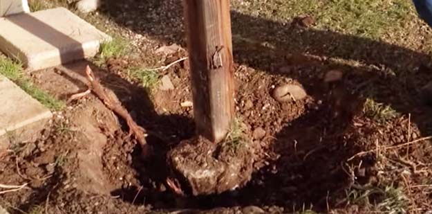 Concrete fence post footing