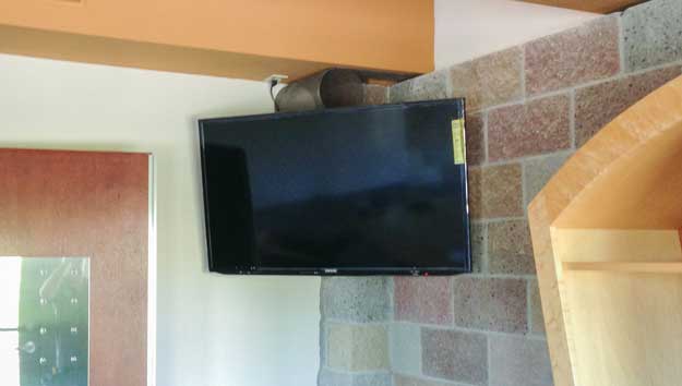 TV mounted to brick