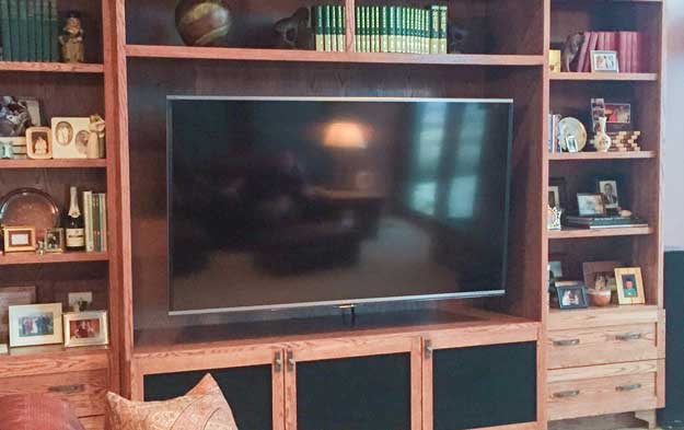 TV mounted to entertainment center